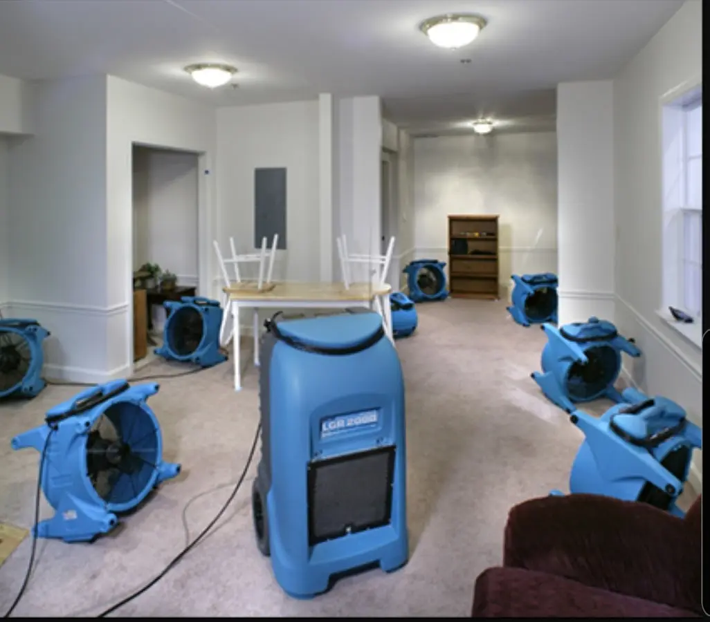 Air movers and dehumidifier setup for Water Damage Restoration in Clark